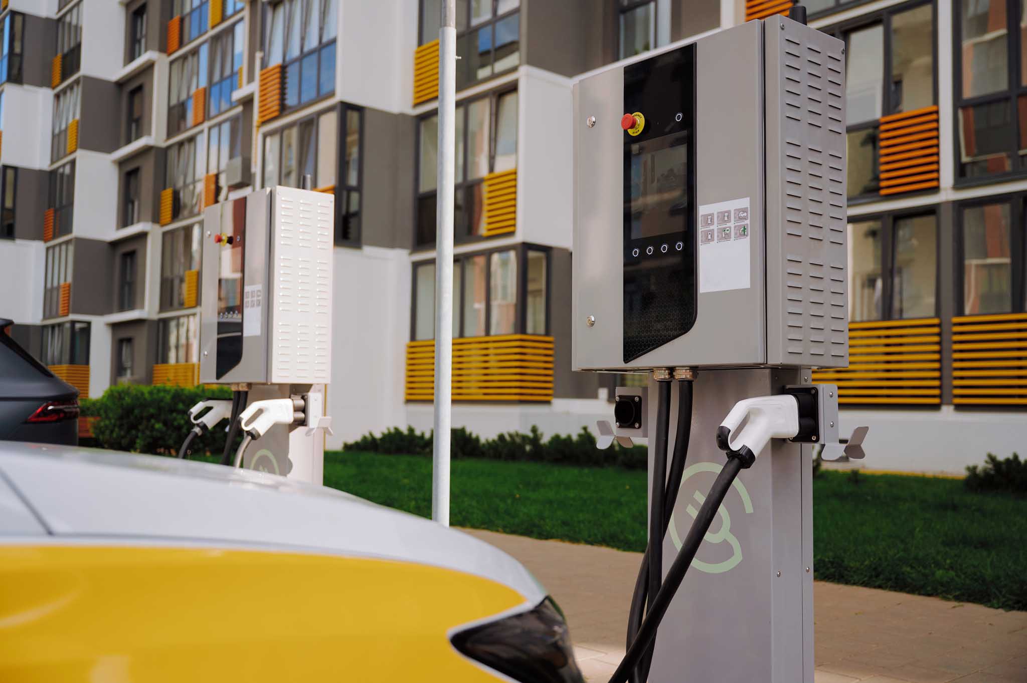 Electric vehicle charging stations outside apartment building